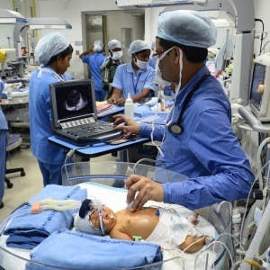 Doctor checking the newborn's parameters in the NRC 100 that provides easy all-round accessibility