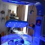 A newborn undergoing phototherapy for jaundice is being treated with the Brilliance Pro device while in a Phoenix warmer.